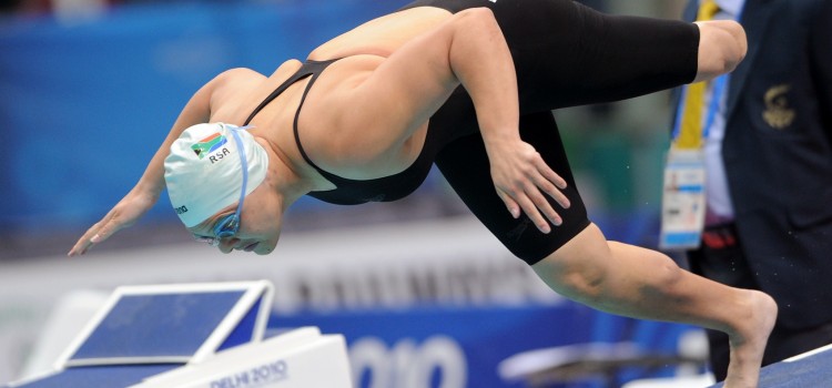 Photo of swimmer Natalie Du Toit jumping into pool