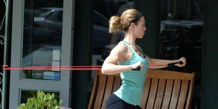 Workout addict Jessica Biel stretching. 