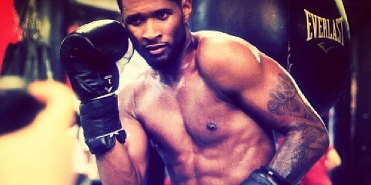 Workout addict Usher showing boxing skills