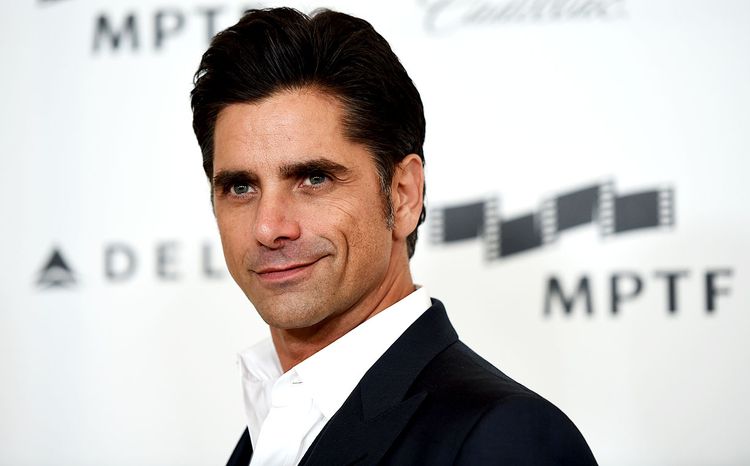 Photo of John Stamos looking youthful