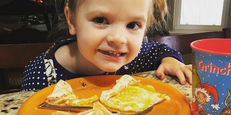 image of a girl eating her breakfast