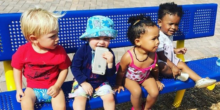 image of the kids sitting on the bench