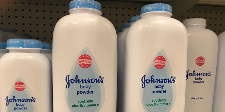 Photo of baby powder bottles on shelf in store