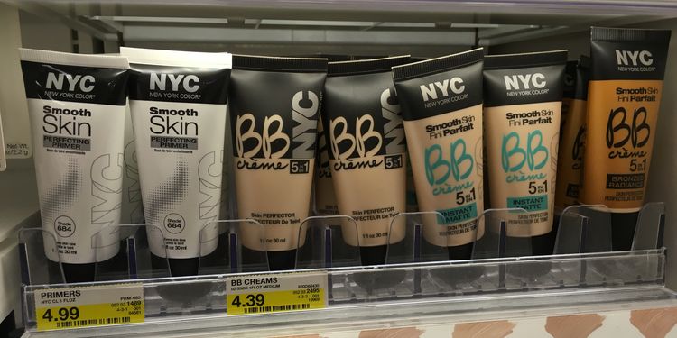 Photo of liquid foundation and concealer bottles on shelf