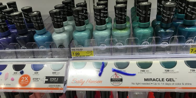 Photo of nail polish bottles on shelf in store