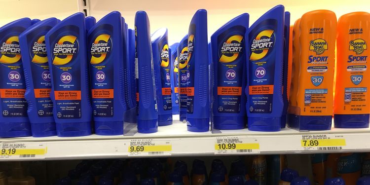 Photo of sunscreen bottles on shelf in store