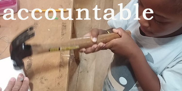 Image of a boy nailing