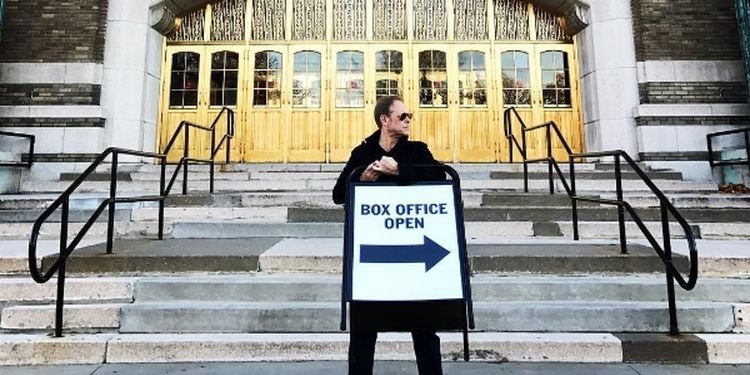 Image of Alton Brown, a millionaire who shares happiness tips