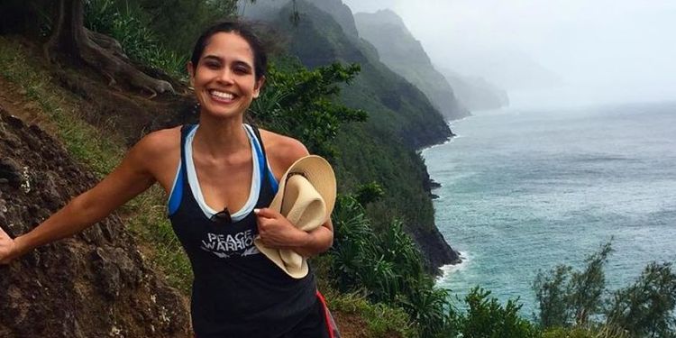 Wellness warrior Kimberly Snyder jogging outdoors.