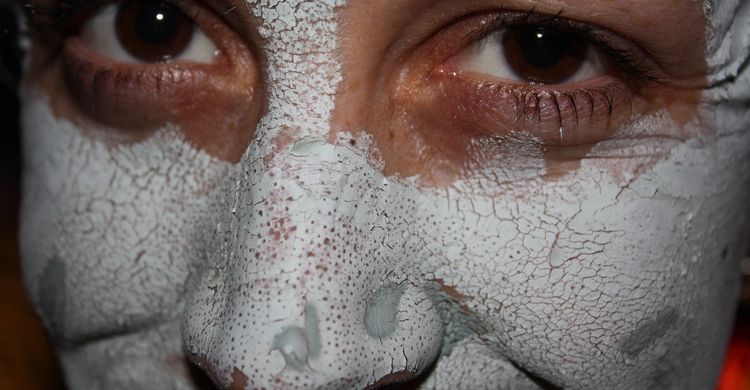 Photo close up of female face with bentonite clay mask