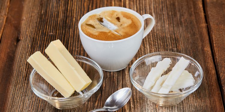 Photo of Coffee, butter and coconut oil for bulletproof coffee on a brown wooden table