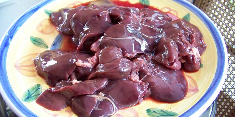 Photo of raw chicken liver at plate