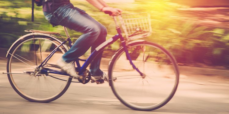 Photo of a man riding bycicle