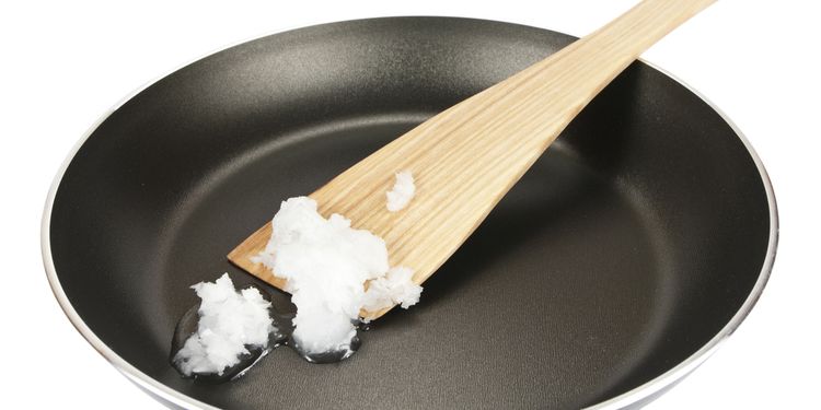 Extra virgin coconut oil in frying pan