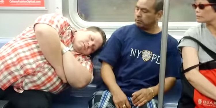 Photo of man sleeps on fellow traveler's shoulder in public transport