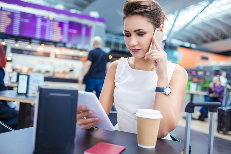 Photo of a woman talking to a phone