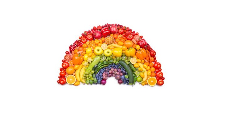 Photo of a fruit arranged in a form of rainbow