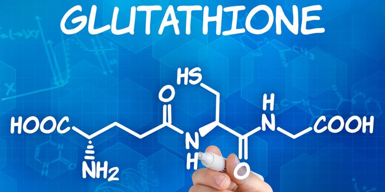 Image of hand with pen drawing the chemical formula of Glutathione