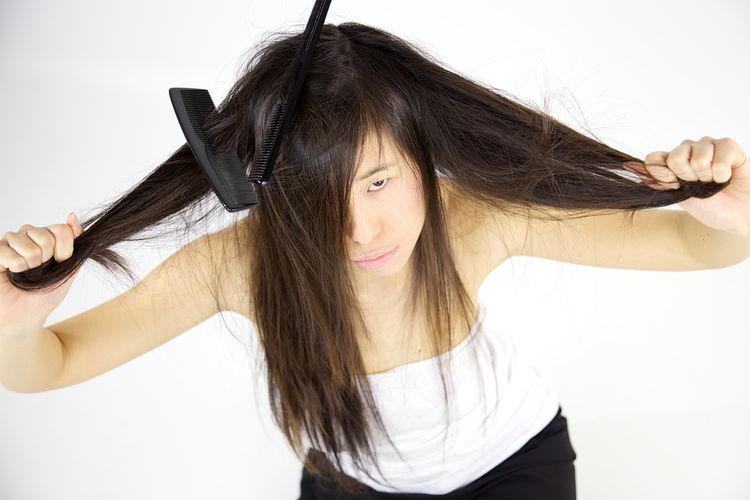 Photo of a girl Having Trouble With Long Hair