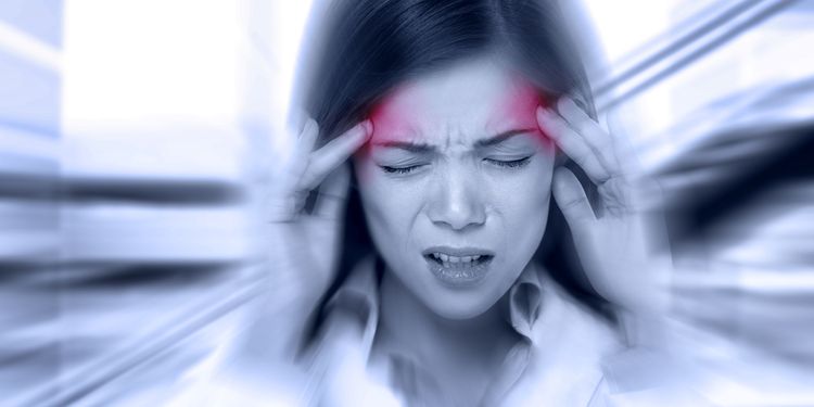 Photo of woman suffering from tension type headache