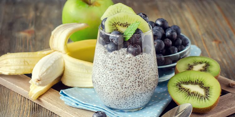 Healthy breakfast or morning snack with chia seeds pudding and berries on wooden rustic background