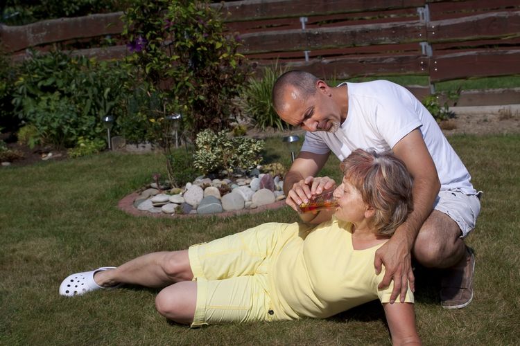 Photo of a woman with Hypoglycemia lying on ground