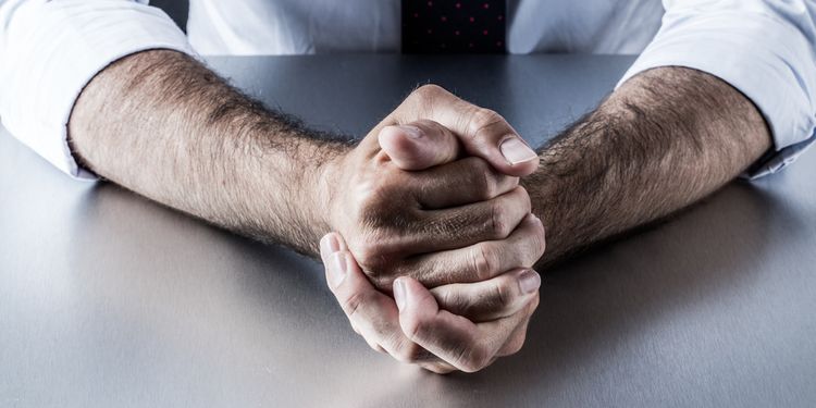 Photo of male arms showing signs of impatience