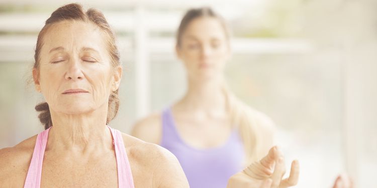 Photo of an older woman meditating