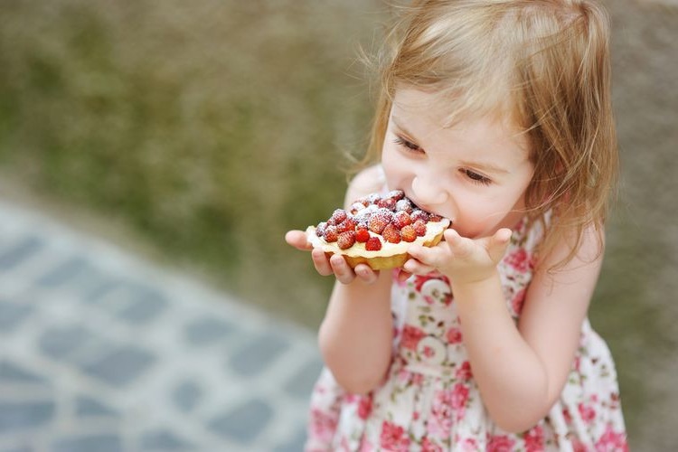 Photo of a Kid Eating Tart