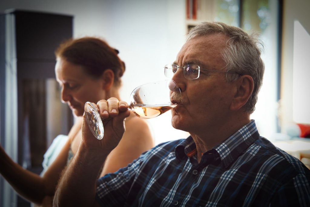 man drinking wine