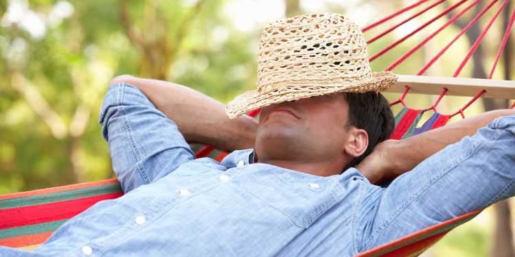 Photo of a man sleeping in hammock