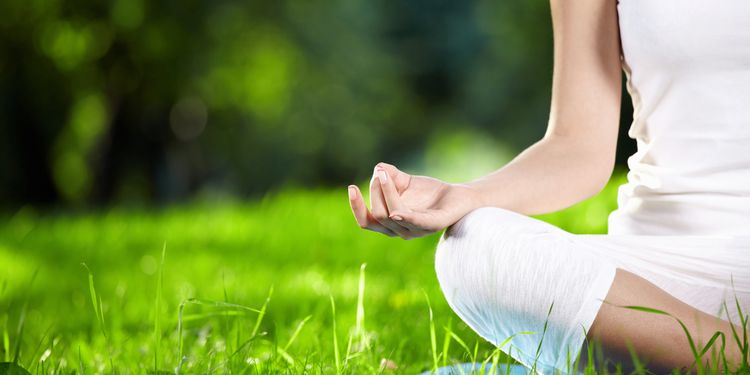 Photo of a woman meditation outdoors