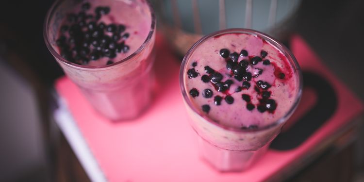 Photo of two glasses of nut blueberry smoothie