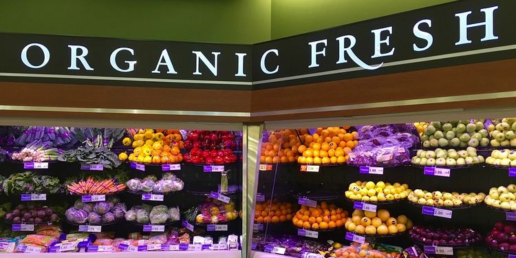 Photo of organic produce on shelves in market