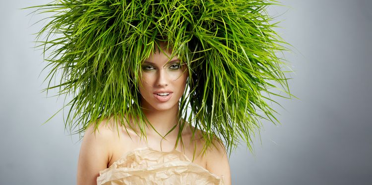 Photo of a woman with grass growing on her head