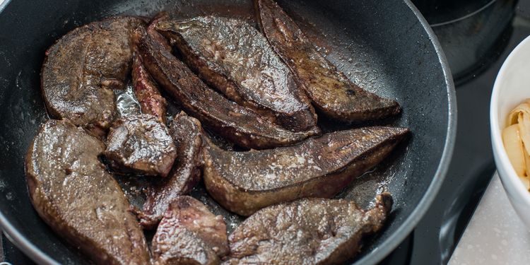 Photo of fried beef liver in a pan