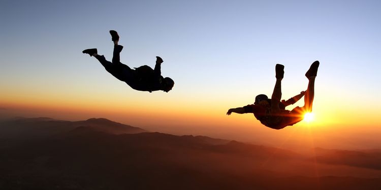 Photo of two people skydive