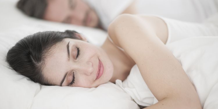 Photo of happy woman sleeping