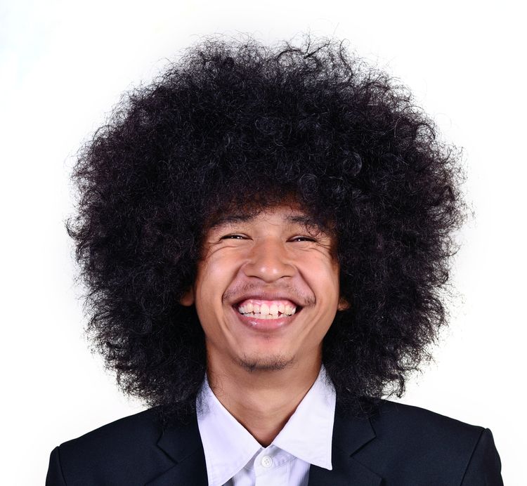 Photo of a man Smiling Huge Hair