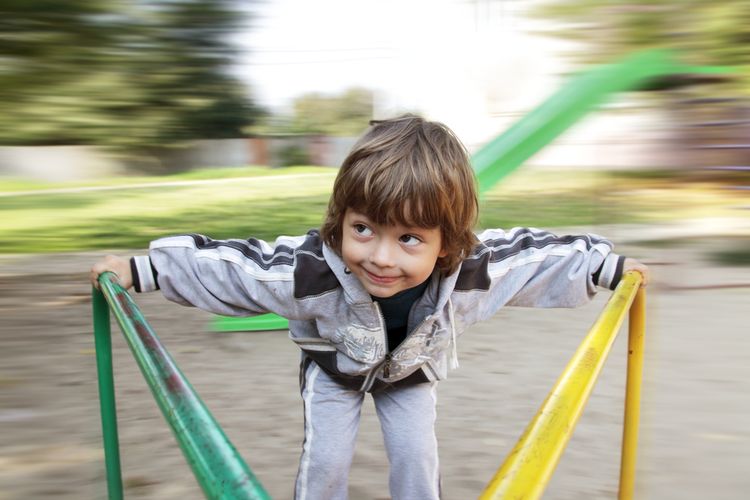 Photo of a boy spinning on a wheel in lunapark