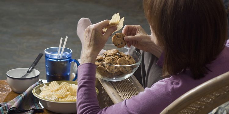 Photo of woman eating junk food