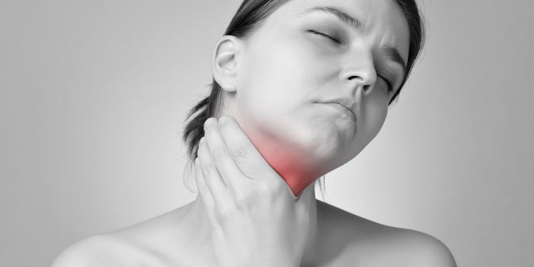 Photo of a woman with thyroid pain