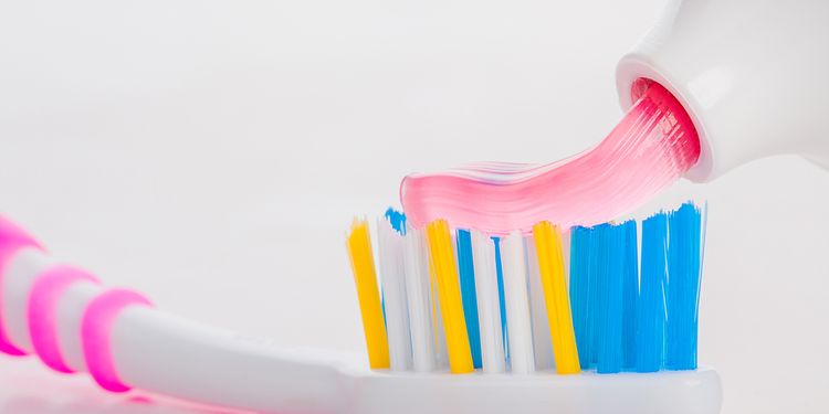 Photo of toothpaste on a toothbrush