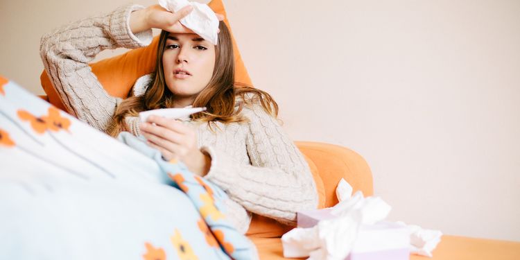 Photo of an ill girl lying in bed