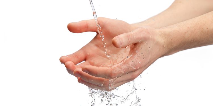 Photo of a hands washed in a leaking water