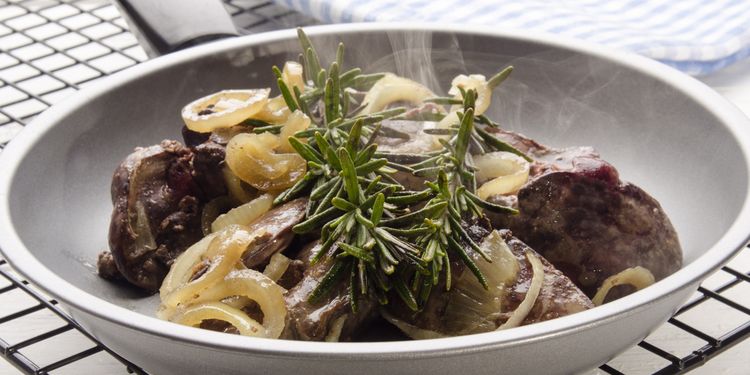 Photo of cooked liver with onions in a plate