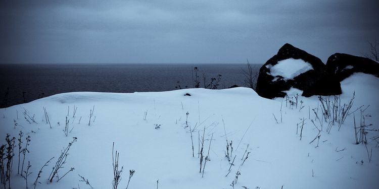 Photo of sea skyline at winter, cloudy and dark