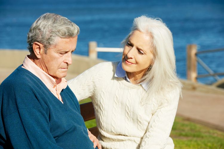 Woman Comforting Depressed Husband