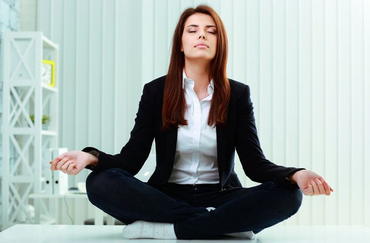 Photoof a business Woman Meditating