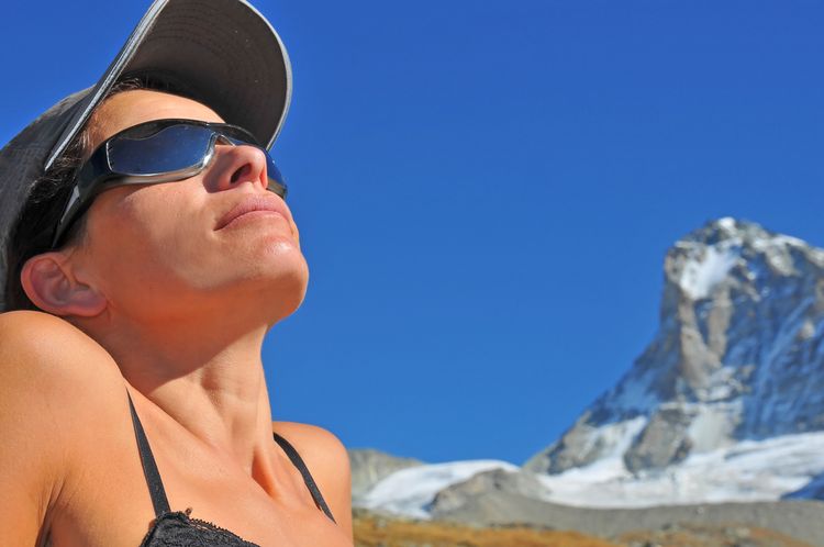 Photo of a Woman Relaxes Soaking Up In Sun